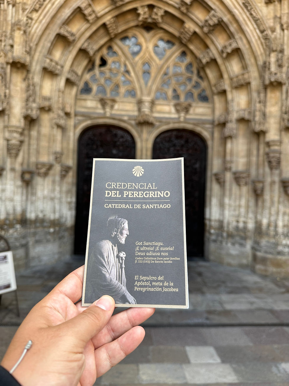 A pilgrim shows the Camino de Santiago credential, the official passport to be stamped along the stages of the journey.