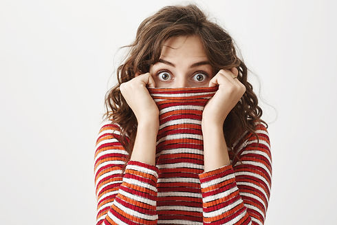 silly-cute-girl-hiding-inside-sweater-peeing-surprised.jpg
