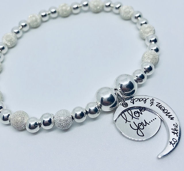 Thumbnail: Sterling Silver Bracelet with Glitter Beads and 'Moon and Back' Charm