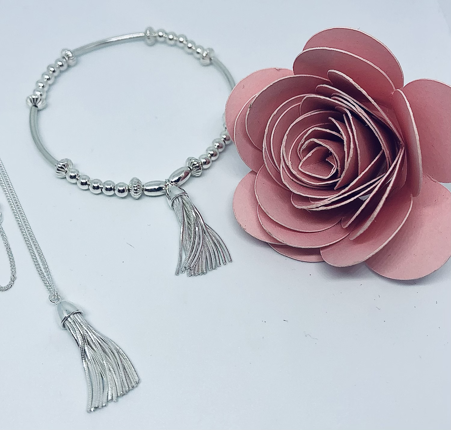 Sterling silver tassel set.