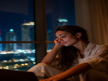 An  Aarabic woman professional in her apartment at night on a zoom session with her sleep coach Adrian Wesley