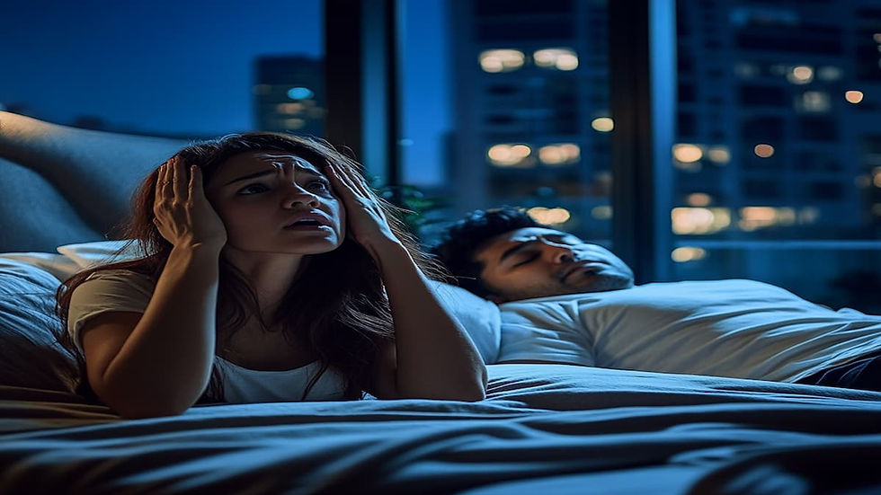 A Canadian woman sitting up in bed at night because her husband sleep beside her is snoring in their Singapore apartment