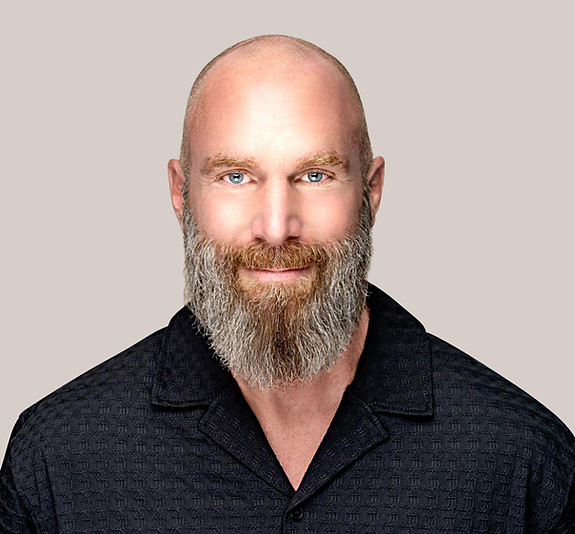 Adrian Wesley, Clinical Hypnotherapist in Vancouver BC with a blue shirt and grey brown beard