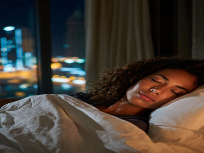 An African woman sleeping deeply in REM sleep in Dubai