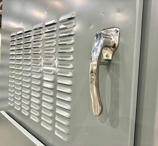 Close-up of three-point latching handle and locking mechanism on enclosure door