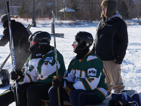 Hockey players on the sidelines