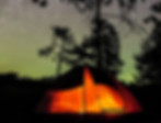 Tent below a starry sky.