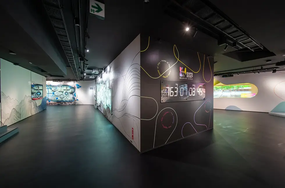 Futuristic room with digital countdown displaying "163:01:08:49" for Expo 2027, Belgrade. Curved walls feature abstract art and neon lines.