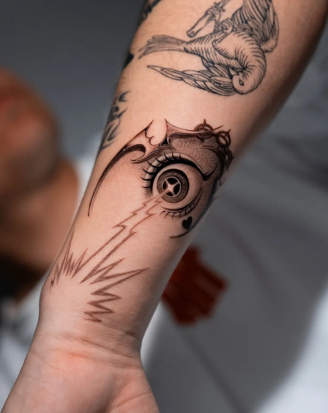 emil chrome eye fine line tattoo on forearm — Seoul Ink Tattoo, Gangnam Seoul