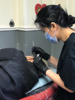 Tattoo artist Ivy at KTREW Tattoo Birmingham UK