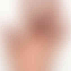 A horseshoe tattoo on a man's middle finger