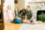 Lifestyle in-home newborn photo of a family with their newborn baby and dog in Plymouth, Minnesota