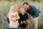 Smiling family photo of a mom, dad and their children enjoying time together in Plymouth, Minnesota.