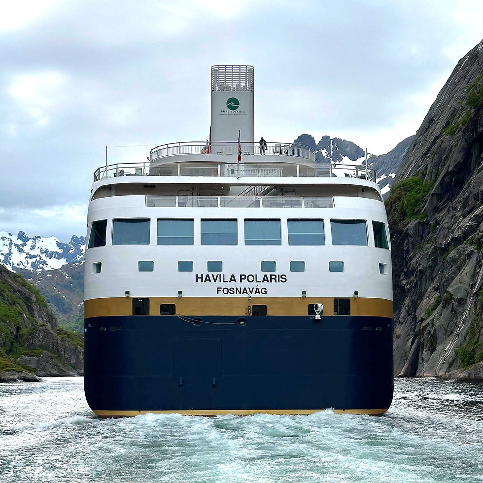 Havila Polaris negotiating the Troll Fjord on battery electric power. Photographed from our excursion boat.