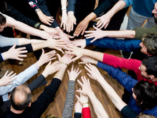 An organization consolidates four businesses into one