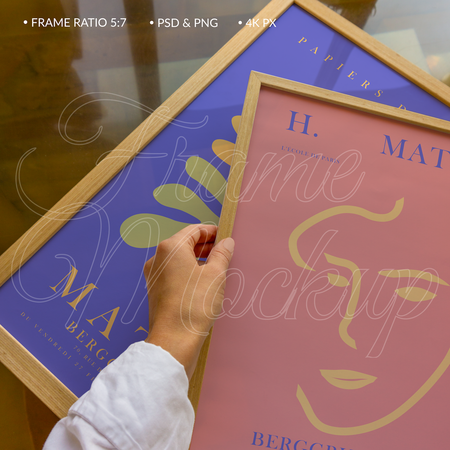 Two wooden frames close-up mockup for posters on the table in minimalistic style with soft natural light with a hand, 300 dpi