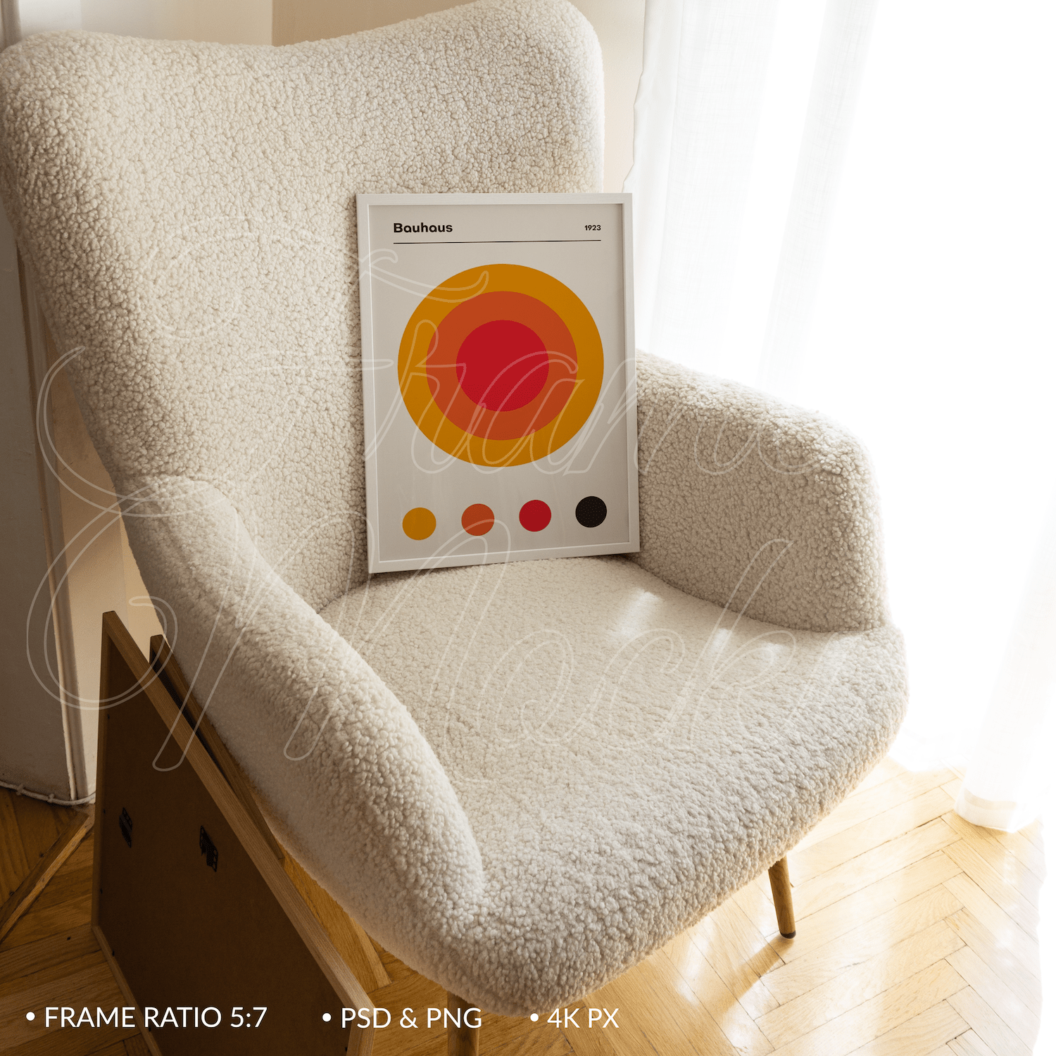 White frame mockup for poster 5x7 ratio in white fur armchair in soft natural light.