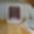 Two wooden frames mockup for poster 4x5 ratio stand on the wooden floor next to the bed in a minimalistic interior with books