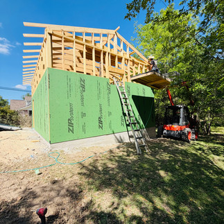 Side view of framed structure with overhang beams