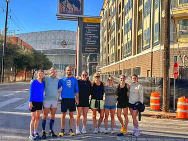 A group of running explained athletes at the Houston Marathon