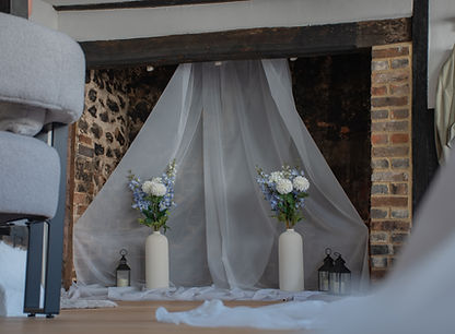 Fireplace with flowers in bridal shop