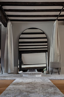 Mirror and changing room in bridal boutique