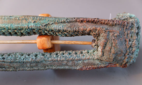 Showing the underneath of Holdfast, a tool from the Memory Tools Collection. Cast from crochet, fabric, stitching with post cast treatment and added wood, magnifying plastic, and DIY Hardware