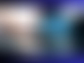 Futuristic brain graphic beside a laptop on an office desk