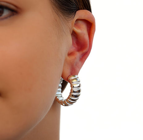 Gen4 Enhance this image into a professional photoshoot style Keep the earring exactly as  