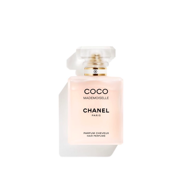 Chanel Coco Mademoiselle hair perfume bottle on white background. Square, translucent peach color with bold black text / COCO MADEMOISELLE Hair Perfume