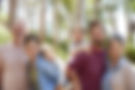 Smiling multigenerational family outdoors for estate planning.