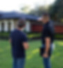 4D Roofing & Restoration inspector pointing out visible roof damage to a potential client 