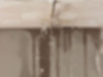 ceiling with water dripping form between tiles and causing water damage