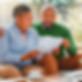 Couple reviewing documents with a financial consultant.