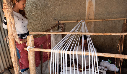 Weaver with traditional loom