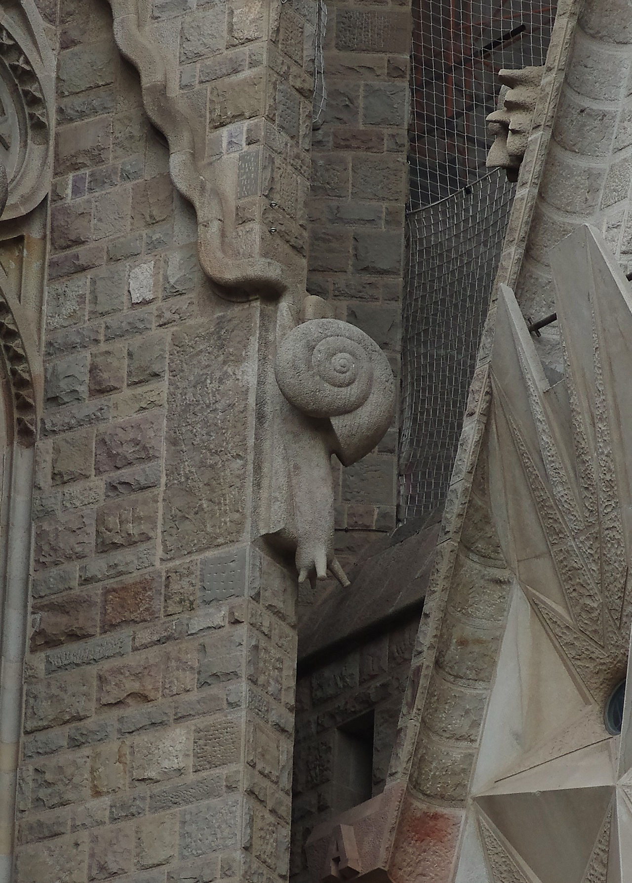 carved stone snail gargoyle