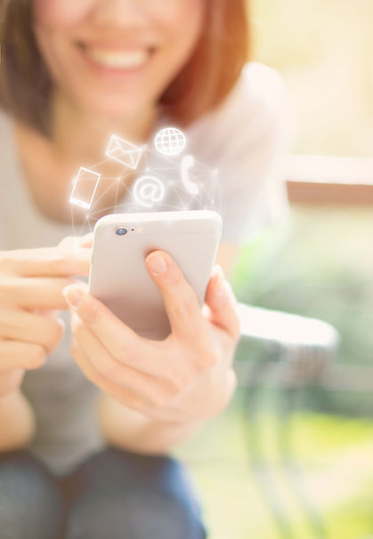 woman holding a cellphone with floating icons above it