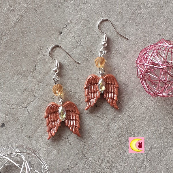 Boucles d'oreilles copper wings porcelaine froide de loin