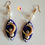 Thumbnail: Boucles d'oreilles purple moonstick sur fond blanc uni naoko takeuchi