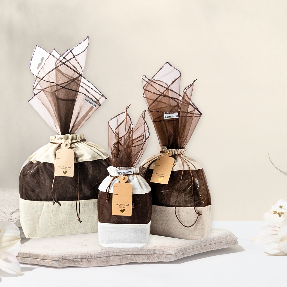 Cotton linen reusable gift bags from Beauty Blisss in three sizes with kraft tags and organza windows.