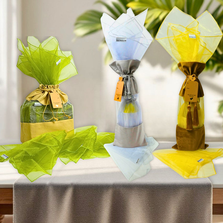 Organza wrap fillers styled with reusable gift bags in green, gray, and gold for a gift-ready presentation