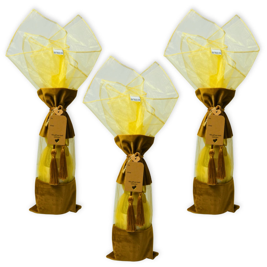 Set of 3 bronze velvet wine gift bags with tassel drawstring, gold organza wrap fillers, and kraft tags in gift ready display