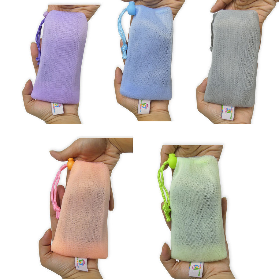 Nylon mesh soap saver bags in five pastel colors shown in hand to display size and toggle drawstring.