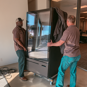 kwanterabyte_Generate_a_11_Image_of_2_men_moving_a_HAHA_smart_f80c0f27-ee07-435b-8867-0daf
