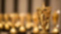 vecteezy_golden-award-trophy-star-on-a-bokeh-background_75834409.jpeg