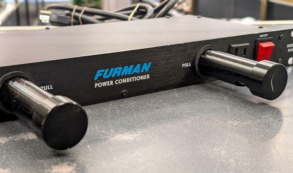 Front and rear views of a Furman M-8L Merit Series rack power conditioner showing pull-out rack lights, dimmer, front outlet