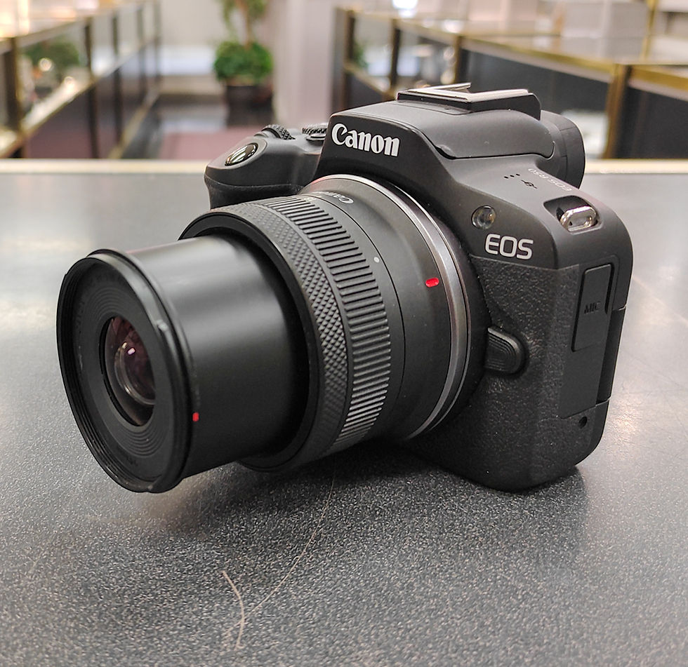 Thumbnail: Canon EOS R50 mirrorless camera with RF-S 18-45mm IS STM lens, Canon LP-E17 battery, and Canon battery charger mint condition