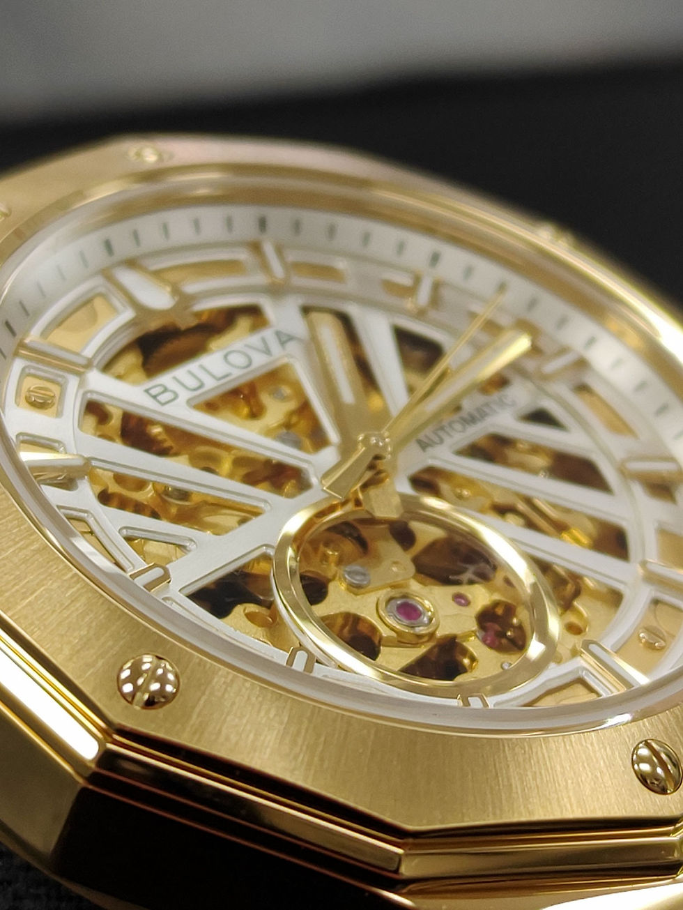 Thumbnail: Brand new Bulova Maquina 97A206 gold-tone automatic skeleton watch with black leather strap and original box