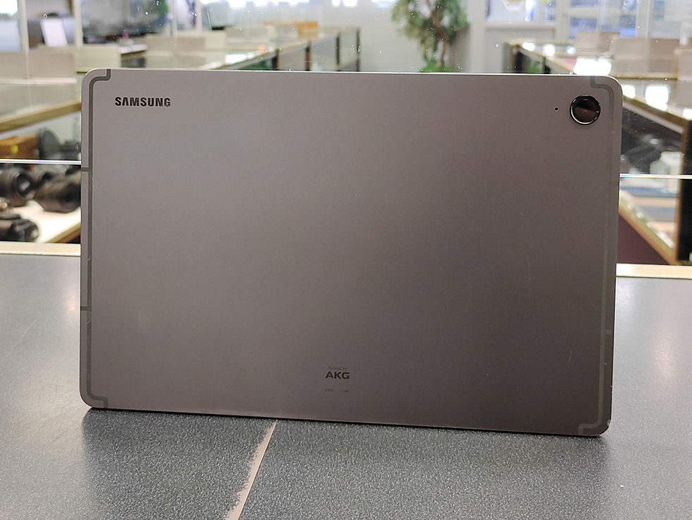 Thumbnail: Samsung Galaxy Tab S9 FE gray tablet shown from front, back, and side views with screen, ports, branding, and camera details