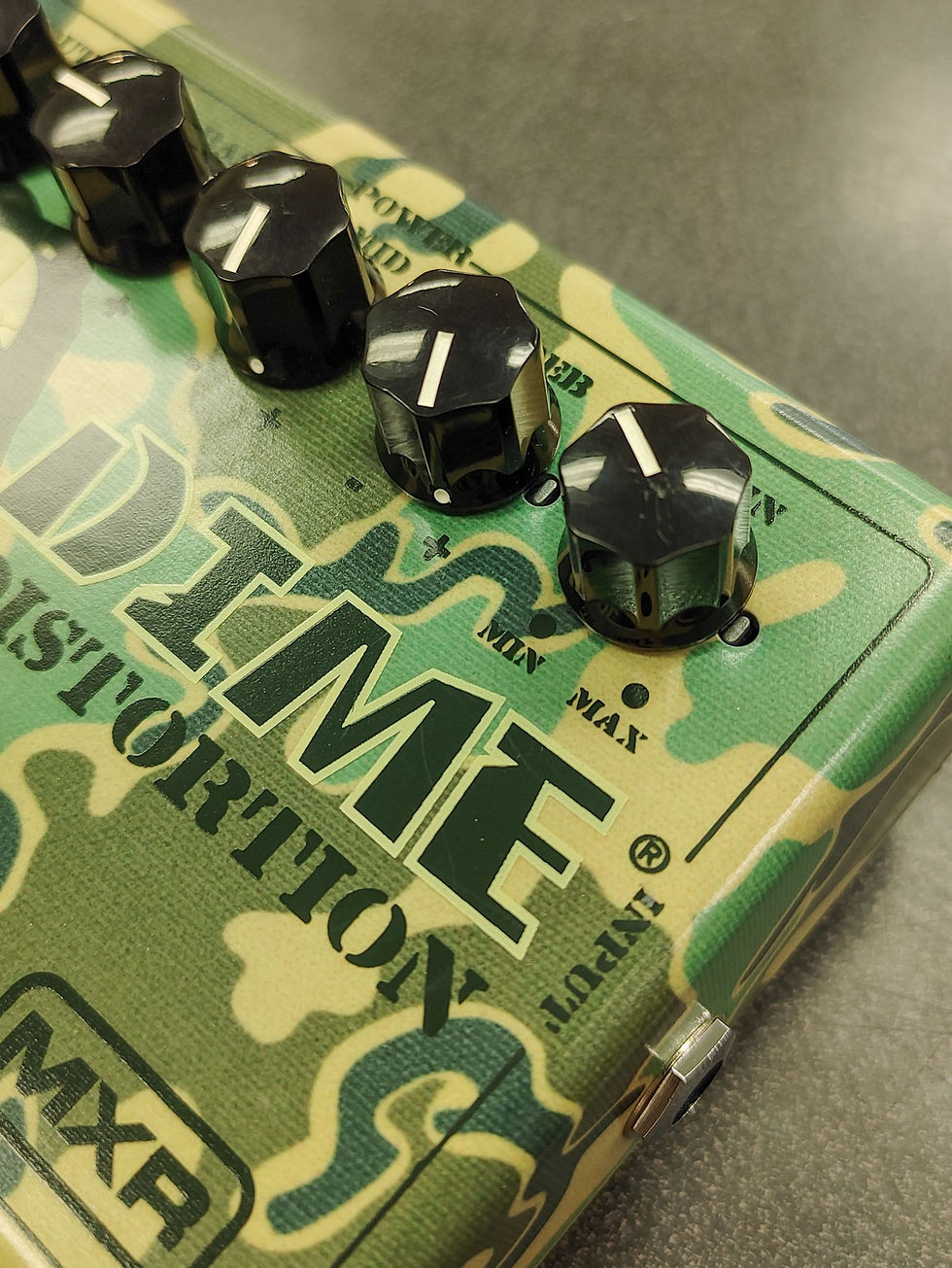 Thumbnail: MXR DD11 Dime Distortion camouflage guitar pedal shown from front, sides, top controls, input/output jacks, power jack